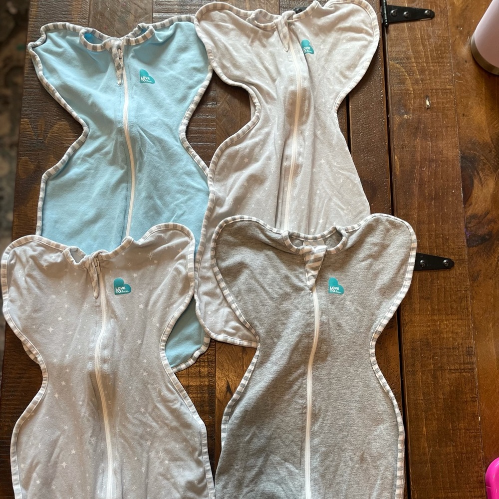 4 Newborn Love to Dream Swaddles Like New— worn few times.